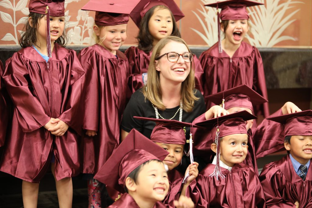 little children dressed in graduation outfits